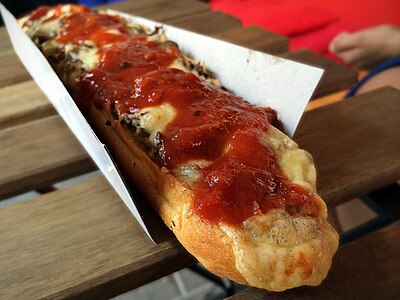 Zapiekanka, a baguette with melted cheese, meat, mushrooms, onions and ketchup. A popular street food to this day which originated in the 1970s