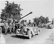 Harry S. Truman, the president of the United States, standing in Stoewer Arkona, while inspecting units of the 3rd Armored Division of the United States Army near Frankfurt, Germany, on 26 July 1945. President Truman, standing in open car, inspects units of the 3rd armored division of the U. S. Army near Frankfort... - NARA - 198689.jpg