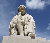 Statue of Dr Johnson erected in 1838 opposite the house where he was born at Lichfield's Market Square. There are also statues of him in London and Uttoxeter.[223]