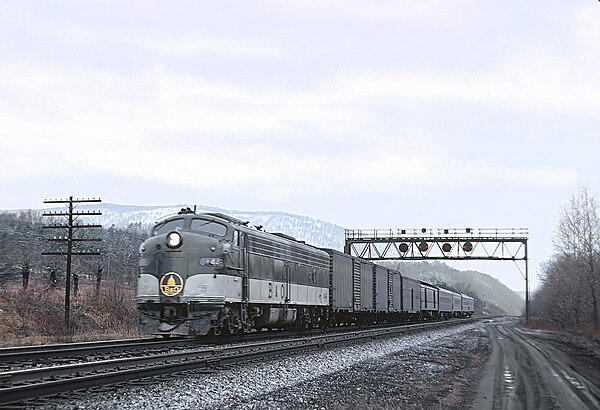 B&O E8A 1445 with train #8, the eastbound Shenandoah, at Great Cacapon, West Virginia on March 2, 1969