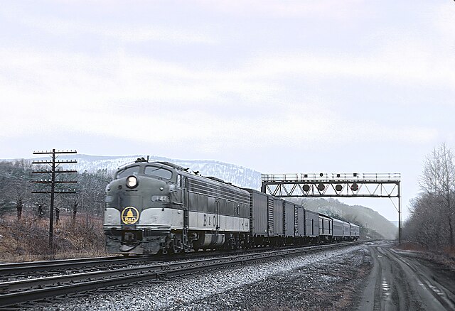 B&O E8A 1445 with train #8, the eastbound Shenandoah, at Great Cacapon, West Virginia on March 2, 1969