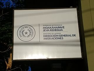Sign in Guaraní and Spanish in Asunción.jpg