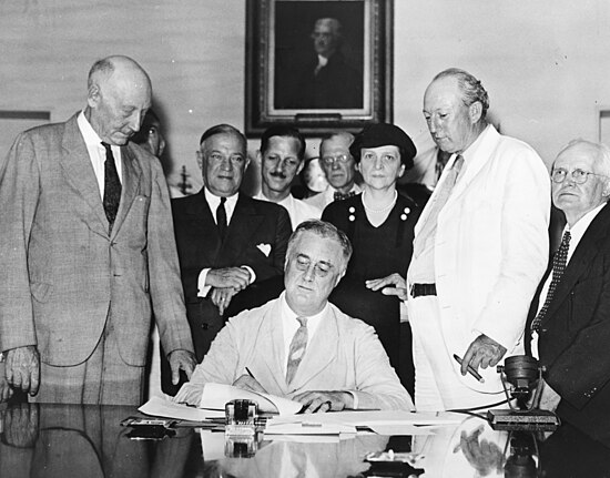 President Roosevelt signing the Social Security Act