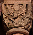 Romanesque capital in Sigolsheim showing Jews with characteristic hats on each lower corner