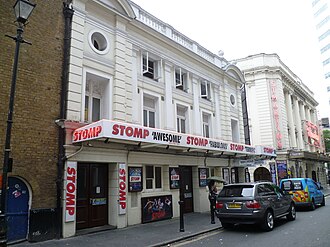 The Ambassadors Theatre with the St Martin's Theatre in the background. Stomp, West Street.jpg