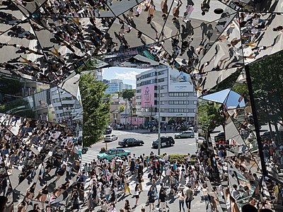 Street crowd reflecting in the mirrors of Tokyu Plaza Omotesando, Tokyo