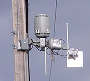 Neighborhood wireless WAN router on telephone pole USI router.jpg