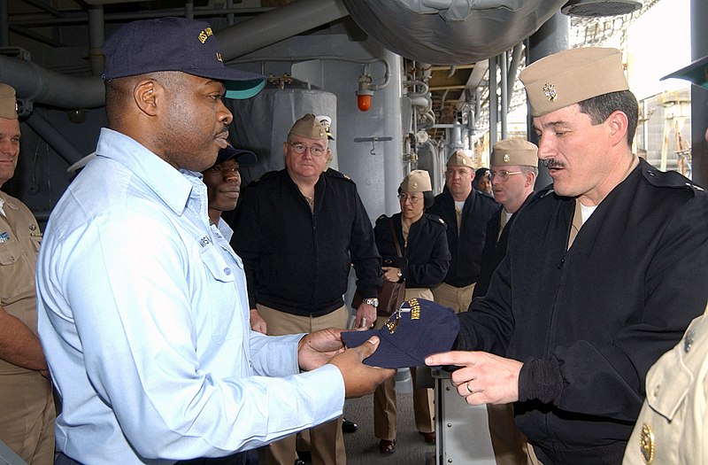 File:US Navy 030328-N-2420K-001 Hull Technician 1st Class Aaron Marshall, Sailor Of the Year presents a command ball cap to Master Chief Petty Officer of the Navy (MCPON) Terry Scott during his visit to Sasebo.jpg