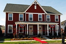 A side by side duplex also known as a semi-detached house. US Navy 061106-N-1023B-014 U.S. Navy Petty Officer Steve Wagner and his family prepare to move into a newly constructed home during a ribbon cutting ceremony at the Village at Whitehurst.jpg