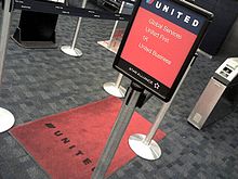 United's red carpet boarding line at San Francisco, the predecessor of the Premier Access Line UnitedRedCarpetBoarding.jpg