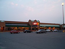 During the Scott/Wood era, A&P started to build modern stores. This unit was in Belleville, Ontario. Note the "sunrise" logo introduced in 1975. View of A&P, Loyalist Market, Belleville, ON..jpg