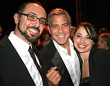 Filmmaker Yoav Potash with actor George Clooney and Potash's wife Shira Potash at the 2012 National Board of Review Awards in New York City. Potash received the Freedom of Expression Award for his documentary Crime After Crime while Clooney was honored with the Best Actor Award for The Descendants. Yoav Potash George Clooney Shira Potash 2012 National Board of Review Awards.jpg
