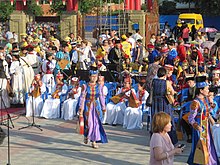 Traditional instruments include the dombra. Vo vremia repetitsii svodnogo orkestra dombristov v Eliste, 14.06.2015.jpg