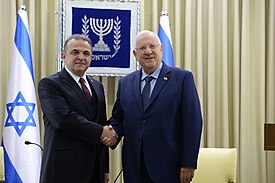 Turkish ambassador to Israel Kemal Okem presents his letter of credence to the president of Israel Reuven Rivlin on 12 December 2016. SHgryr tvrqyh bySHrAl kAml Avqvm mgySH At ktb hAmntv (1).jpg