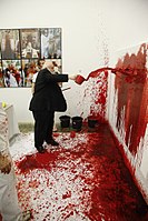 Hermann Nitsch carrying out a performance in his homonymous museum (2009)