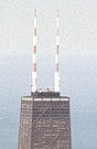 John Hancock Center in 1974, with the original stripped paint scheme visible on its antenna towers