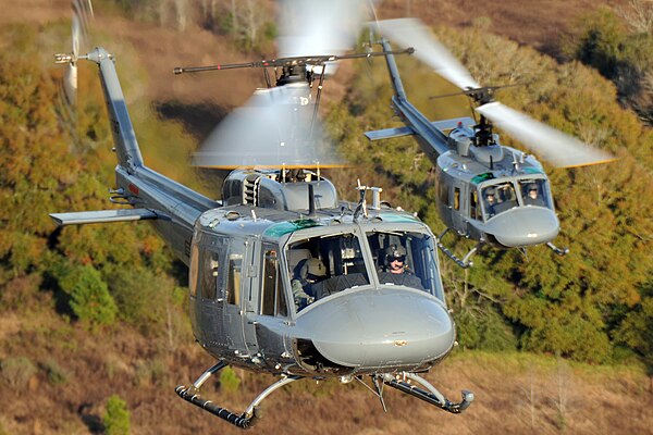 Squadron student pilots practice landing TH-1H helicopters during formation-flight patterns