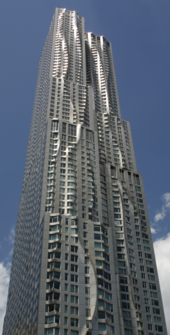 8 Spruce Street in Manhattan with rippling stainless steel on three of its elevations including the east elevation facing Brooklyn but a more typical flat surface on its south elevation facing Wall Street and the financial district A611, 8 Spruce Street, Manhattan, July 2019.png