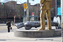 The monument features a silver-coloured soldier of the 16th U.S. Infantry Regiment toppled in front a gold-coloured soldier of the Royal Newfoundland Regiment Fencible Infantry. ASLEEP ON THE JOB (3840135847).jpg