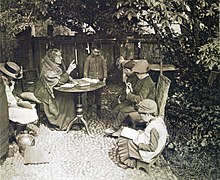 A Dame School lesson in a fisherman's yard in East Anglia in 1887. A Dame's School, Peter Henry Emerson, 1887.jpg