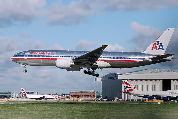 A mainline flight by an American Airlines Boeing 777-200ER lands at London Heathrow Airport, England.