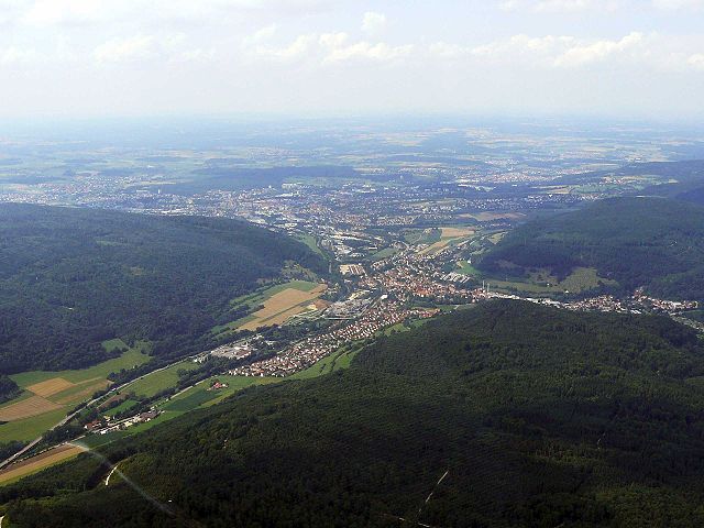 Aerial view of the district of Unterkochen (the town centre is partly covered and in the background), the Aalen lowlands well perceptible in the back