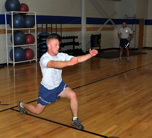 Airman performing lunge