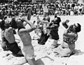 American golfers doing Hokey Pokey on the sandy beach Coolangatta Gold Coast 1953 (13593962104).jpg