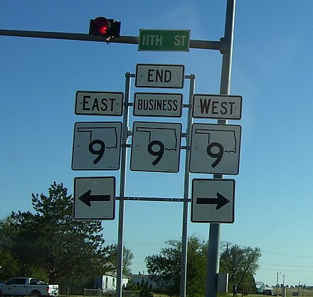 Business SH-9 in Hobart, Oklahoma ends at its parent route. The center SH-9 shield is topped with a "BUSINESS" plate, which is how business routes are typically marked.