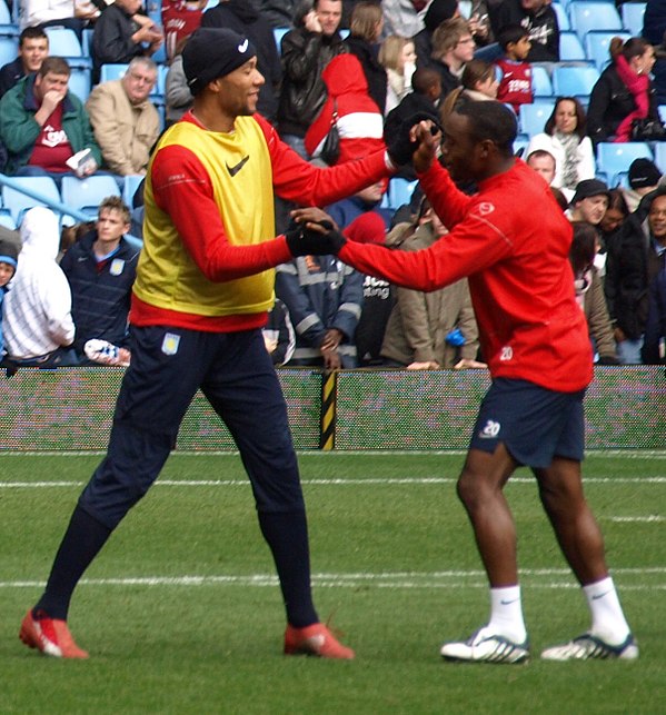 Carew at an open-training session at Villa Park with teammate Nigel Reo-Coker