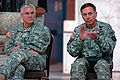 David H. Petraeus claps as Gen. George W. Casey, Jr. looks on during the Multi-National Force - Iraq change of command ceremony, 2007.