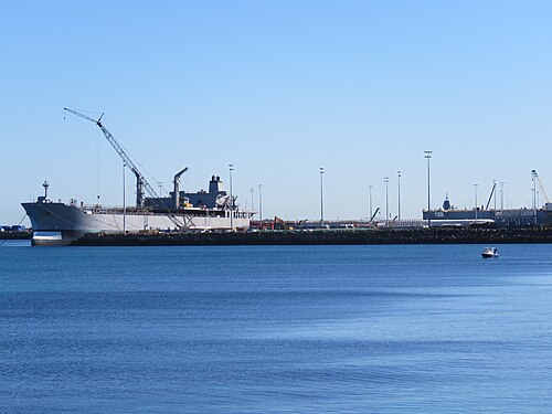 The decommissioned former RAN tanker HMAS Sirius at Henderson, Western Australia, with a recreational fishing vessel to the right