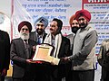 Dr. Yog Raj Angrish being awarded