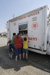 People in Caruthersville, Missouri receiving food and supplies from a Salvation Army disaster relief truck in April 2006 FEMA - 23703 - Photograph by Patsy Lynch taken on 04-13-2006 in Missouri.jpg