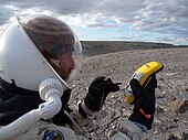 Vernon Kramer uses a Trimble GeoXM GPS to locate the Gemini Hills on EVA 9.