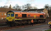 Freightliner 66503 in the latest orange livery, gets ready to take the High Output Ballast Cleaner from Fairwater Yard, Taunton to Highbridge. Fairwater - Freightliner 66503.JPG