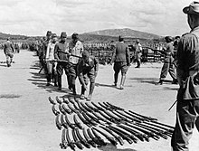 A long line of Japanese officers wait to surrender their swords to the 25th Indian Division in Kuala Lumpur, 1945. Japanese Surrender in Malaya, 1945 IND4851.jpg