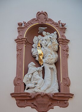 Sculpture in a niche above main door.