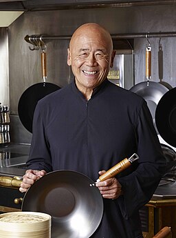 Ken Hom holding wok