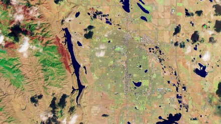 First image from Landsat 8. The area is Fort Collins, Colorado, United States and the image is from the Operational Land Imager (OLI) spectral bands 3 (green), 5 (near infrared), and 7 (short wave infrared 2) displayed as blue, green and red, respectively.