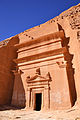 The facade of a tomb with its details and architectural elements in Hegra, Saudi Arabia.