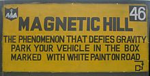 A sign board near the Magnetic Hill in Ladakh, India. Magnetic Hill (India) sign.jpg