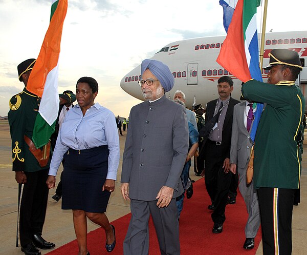 Bathabile receiving Indian Prime Minister Manmohan Singh at Waterkloof Air Force Base on 17 October 2011