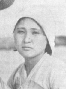 Photograph of a Korean woman in a headscarf