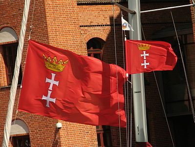 Two flags of Gdańsk on the background, which highlights their beauty.