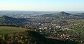 Nearby town Pfullingen (foreground) in the South of Reutlingen (behind the hills), hills Georgenberg (left), Achalm and Scheibengipfel (right)