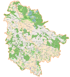 Mapa konturowa powiatu trzebnickiego, u góry po lewej znajduje się punkt z opisem „Zamek w Żmigrodzie”