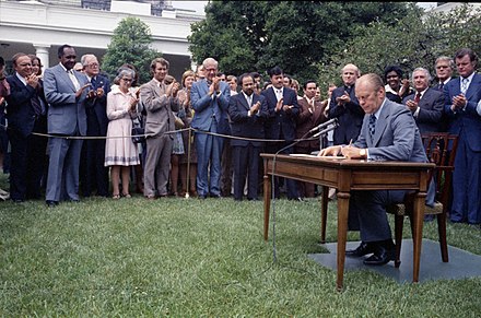 United States President Gerald Ford signs H.R. 6219, Extending the Voting Rights Act of 1965, August 1975.