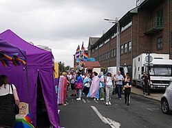 Stalls and crowds along Guildhall Road facing north at Pride in Hull 2022.