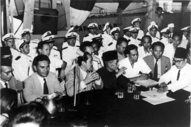 Leimena (third from right) aboard the USS Renville during negotiations with the Dutch